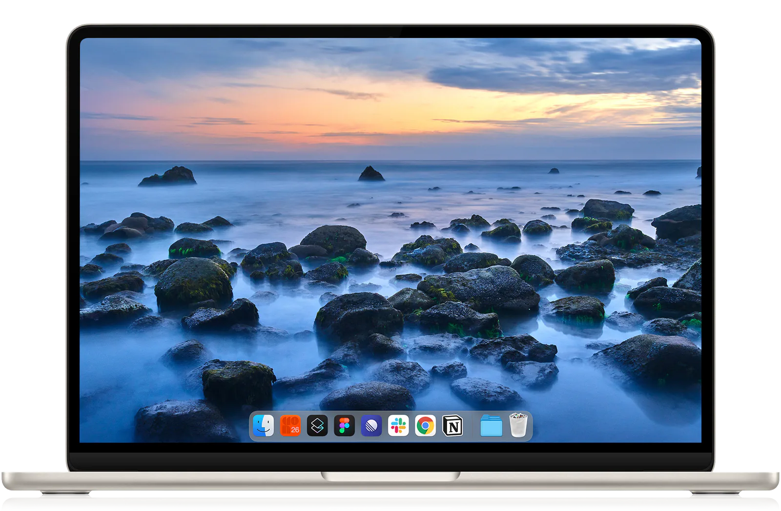 A MacBook displaying Joey Wright's Malibu photograph as its desktop wallpaper